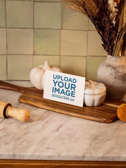 Autumn-Themed Mockup Featuring a Postcard Placed on a Kitchen Counter