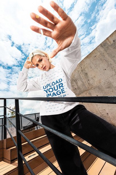 Comfort Colors 1566 Sweatshirt Mockup of a Woman Posing With a Serious Look Standing in the Bleachers 