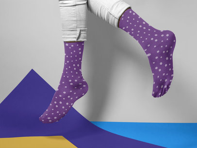 Man Jumping While Wearing Socks Mockup on a Multicolor Surface a15600