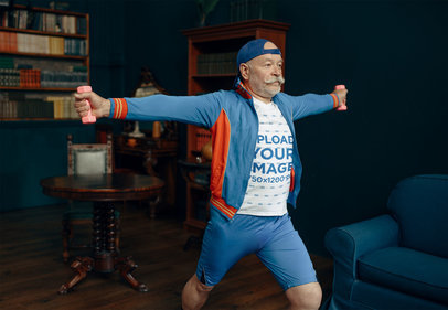 T-Shirt Mockup of a Senior Man With a Mustache Exercising at Home