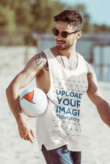 Tank Top Mockup of a Tattooed Man Holding a Volleyball
