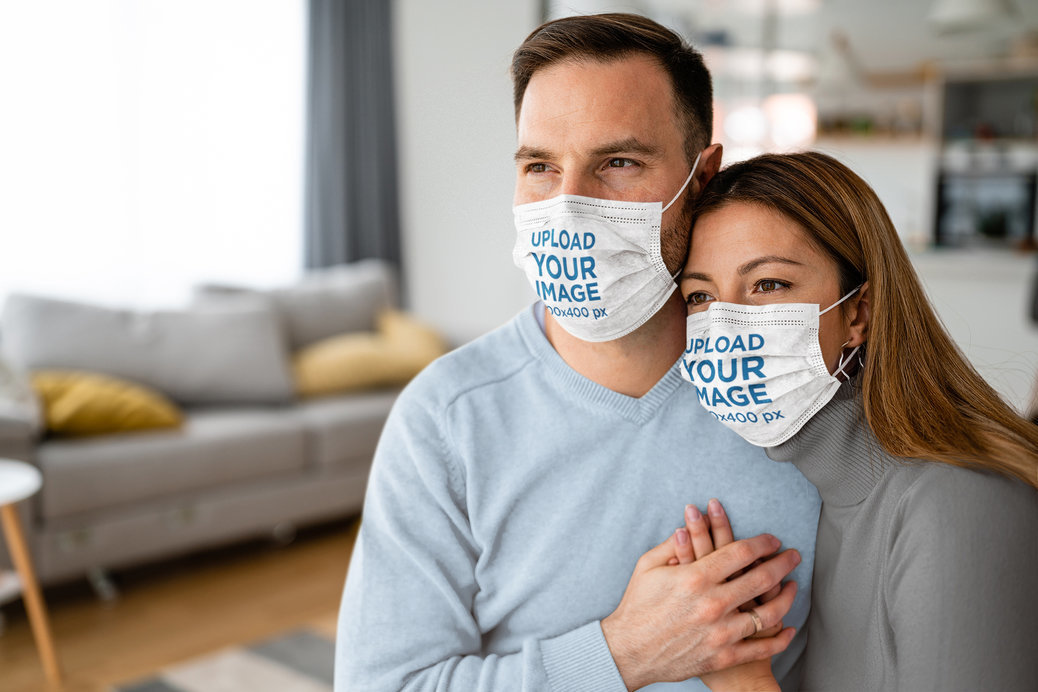 Face Mask Mockup of a Lovely Couple Holding Each Other