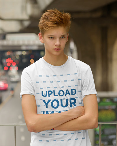 T-Shirt Mockup of a Red-Haired Teenage Boy Posing on the Street