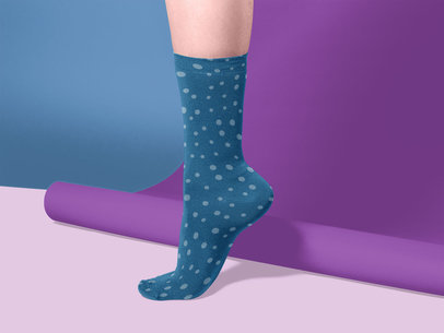 Sock Mockup Being Worn by a Foot on a Colorful Studio a15594