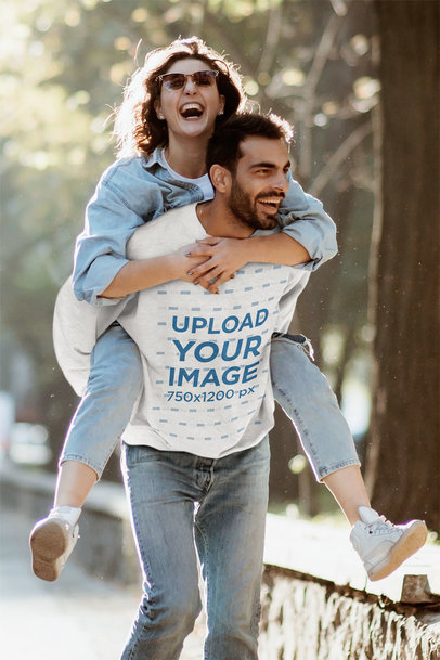 Heathered Sweatshirt of a Happy Man Carrying His Girlfriend on His Back