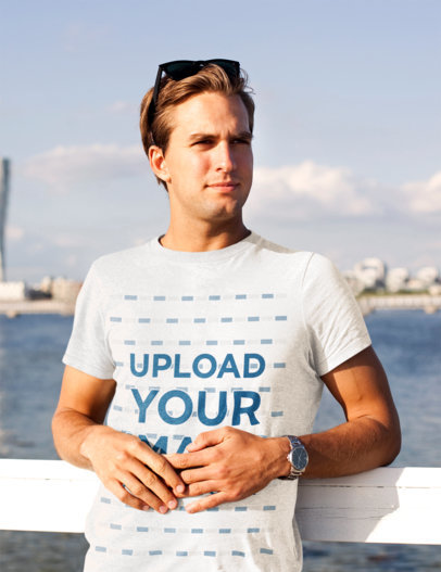 T-Shirt Mockup of a Young Man Posing at a Bay