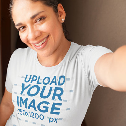 Selfie Mockup of a Hispanic Woman Wearing a Tshirt