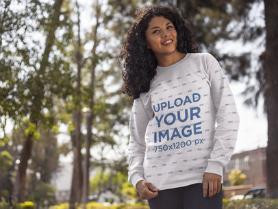 Young Happy Woman Wearing a Crewneck Sweatshirt Mockup While in the Forest