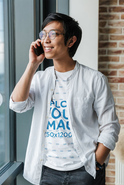 T-Shirt Mockup of a Man With Glasses Making a Phone Call
