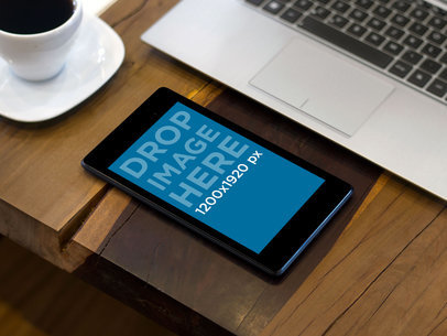 Mockup of a Black Portrait Nexus 7 on a Work Place