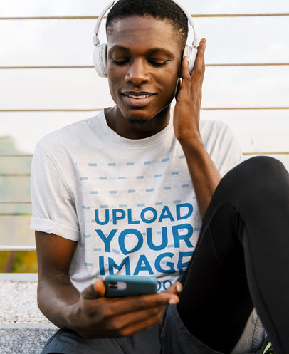 T-Shirt Mockup Featuring a Man Listening to a Good Song 