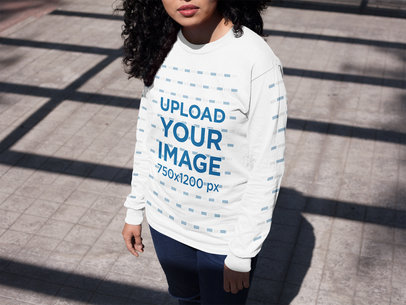 Young Woman Under a Roof Shadow Wearing a Long Sleeve T-Shirt Mockup