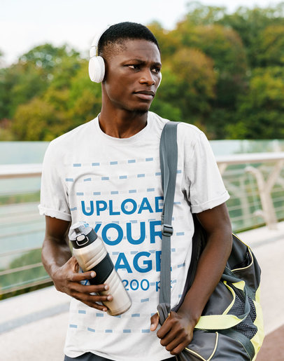Mockup of a Serious Man Wearing a T-Shirt and Headphones