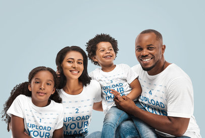 T-Shirt Mockup Featuring a Family of Four in a Studio