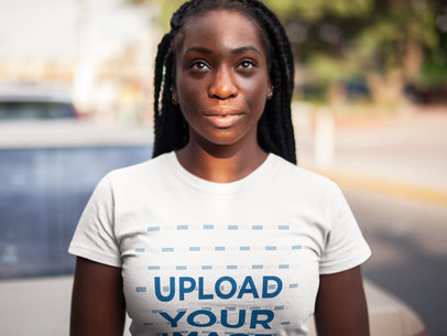 Front Shot Mockup of a Black Girl with Dreadlocks Wearing a Tshirt Mockup While Facing a Ray of Sunlight a15942