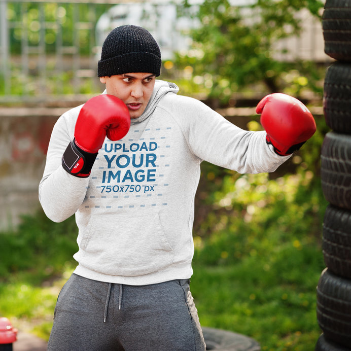 Hoodie Mockup of a Boxer Training in a Park