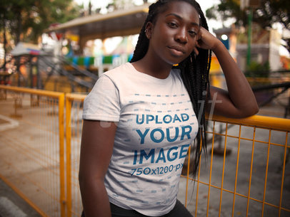 Mockup of a Woman with Locs Waiting for Someone While Wearing a Round Neck Tee Outdoors