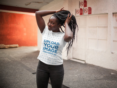 Mockup of a Young Woman with Loc Braids Holding her Hair While Wearing a Round Neck Tee