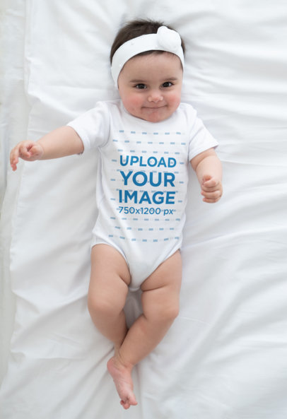 Mockup Featuring a Cute Baby Girl Wearing an All-Over Onesie 