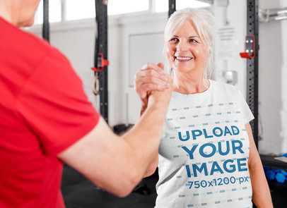 Heathered T-Shirt Mockup Featuring a Smiling Senior Woman at the Gym