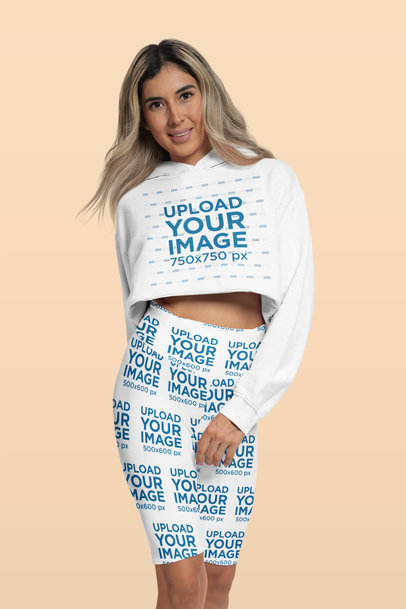 Activewear Mockup of a Woman Wearing Leggings and a Crop Top Hoodie