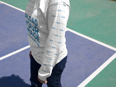 Closeup Mockup of a Woman Wearing a Long Sleeved Tee While at a Tennis Court