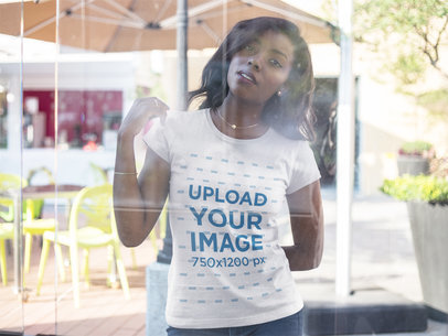 Through the Window Mockup of a Woman Wearing a Round Neck Tee 16054