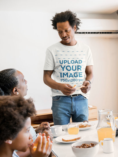T-Shirt Mockup Featuring a Man at the Table with His Family