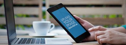 Mockup of a Woman Using a Nexus 7 in Portrait Position