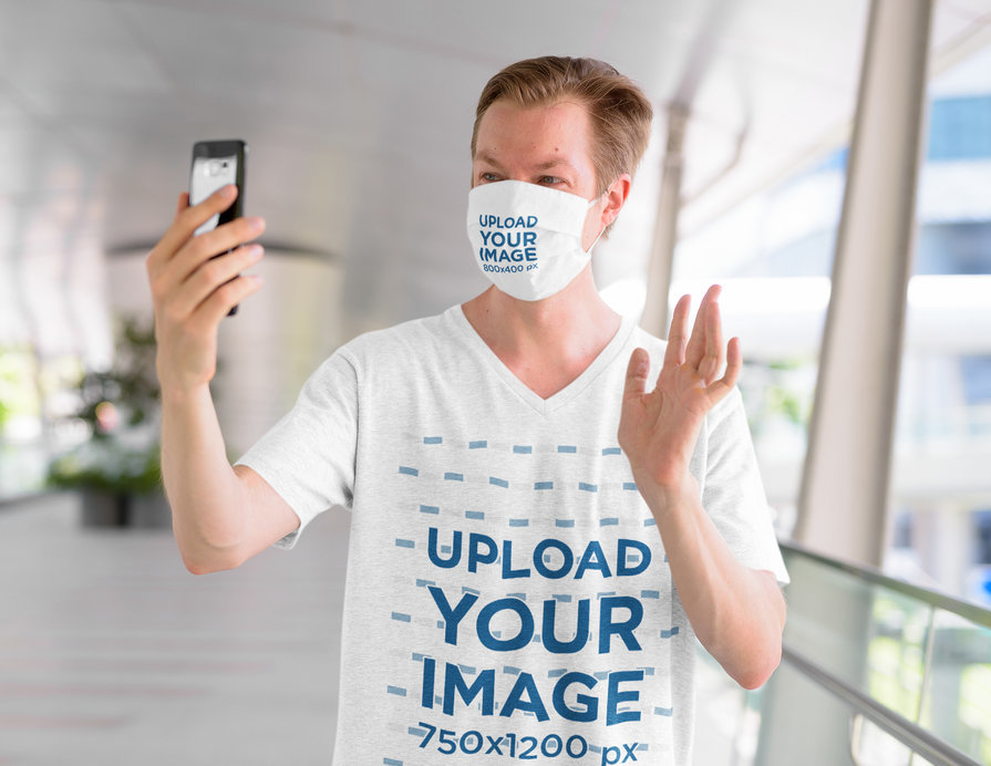 V-Neck Tee and Face Mask Mockup of a Man Doing a Video Call