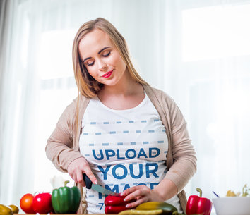 T-Shirt Mockup of a Long-Haired Woman Making a Salad