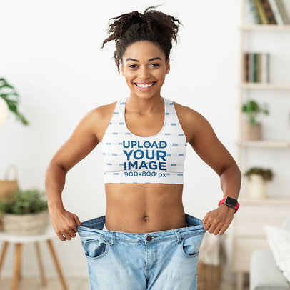 Sports Bra Mockup Featuring a Joyful Woman Showing Her Fitness Progress 