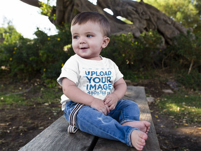 Cute Baby Boy Sitting Down in a Wooden Bench while Wearing a Round Neck Tshirt Template