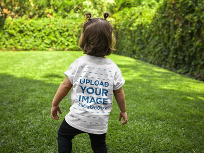 Back of a Little Girl T-Shirt Mockup Standing in the Backyard a16096