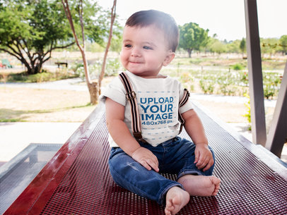 Happy Baby Boy Wearing a Round Neck Tshirt Mockup and Suspenders