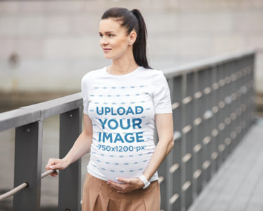 Maternity T-Shirt Mockup of a Woman Walking on a Bridge