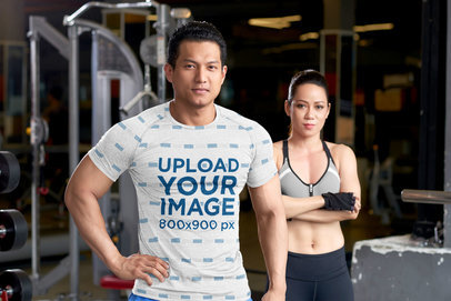 Sublimated Tee Mockup of a Muscular Man and His Partner at the Gym 45130-r-el2