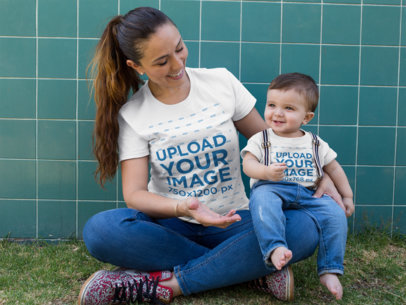 Baby Boy and Mom Wearing Different Round Neck Tees Mockup While Sitting Down Outdoors
