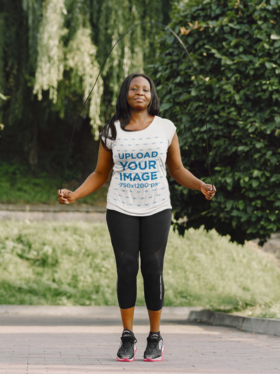 T-Shirt Mockup Featuring a Woman Doing a Jump Rope Workout m6584-r-el2