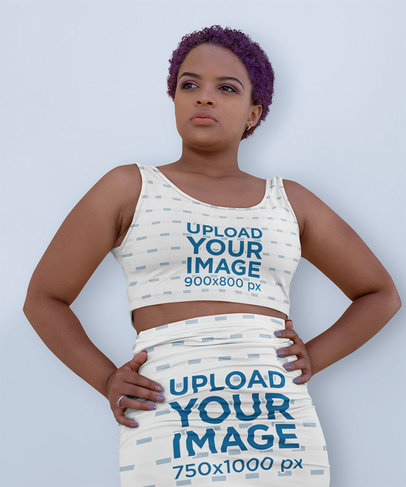 Sports Bra and Pencil Skirt Mockup Featuring a Woman Posing Against a Colored Backdrop m3672-r-el2