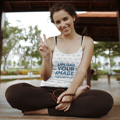 Tank Top Mockup Featuring a Cheerful Woman Making the Peace Sign With Her Hand