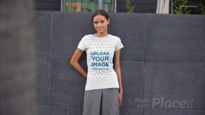 T-Shirt Video Featuring a Young Woman Posing in an Urban Scenario