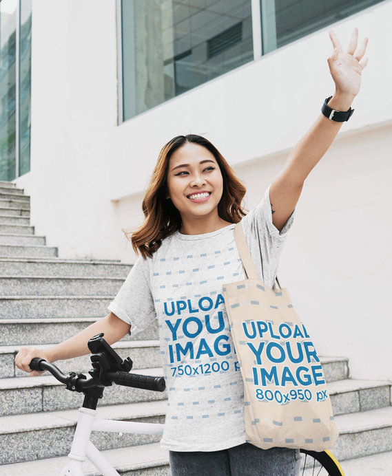 Unisex T-Shirt Mockup of a Woman Carrying a Tote Bag 