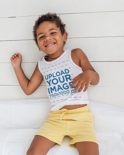 Tank Top Mockup of a Happy Kid Lying on the Floor