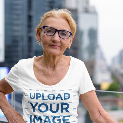 T-Shirt Mockup Featuring a Blonde Senior Woman Posing in a Balcony m7899 r-el2