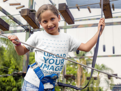 Pretty Kid Wearing a T-Shirt Mockup While at an Extreme Game a16164