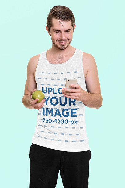 Heathered Tank Top Mockup of a Happy Man Checking His Phone and Holding an Apple