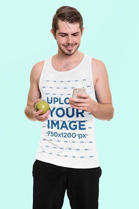 Heathered Tank Top Mockup of a Happy Man Checking His Phone and Holding an Apple