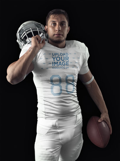 Football Jersey Generator - Standing Man Holding Helmet and Football a15895