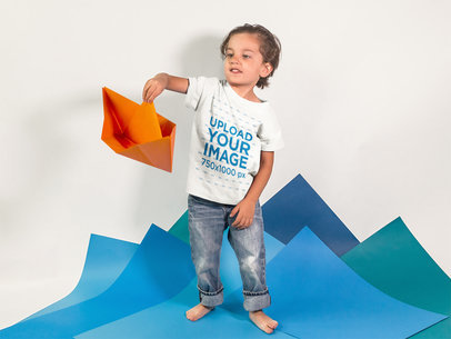 Little Kid Playing with a Paper Boat While Wearing a Round Neck Tshirt Template